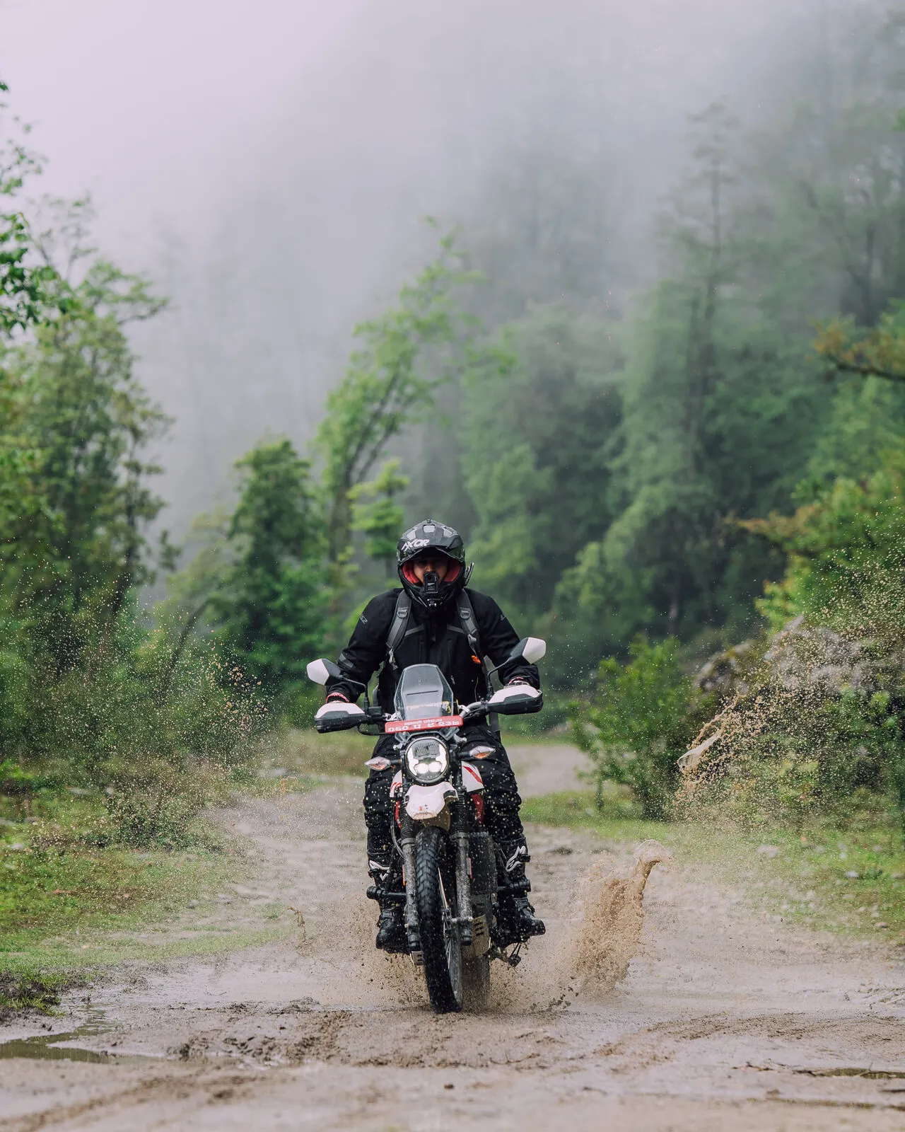 Rider on a misty forest trail on the outskirts of the Kathmandu Valley