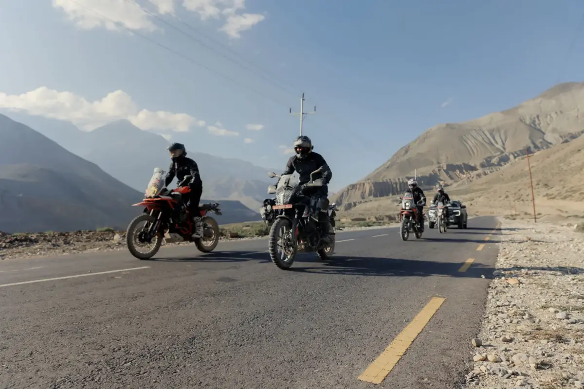 Riders on the road through the Kali Gandaki valley, Lower Mustang
